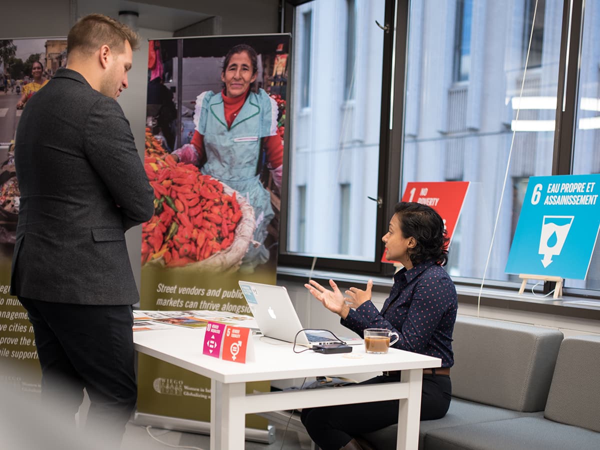A woman and a man having a conversation about Sustainable Development Goals